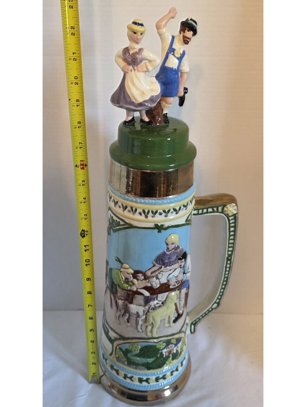 23" Lg Decorative German Beer Stein a couple in traditional attire and a tavern